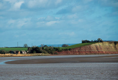 Scenic view of river severn against cloudy sky