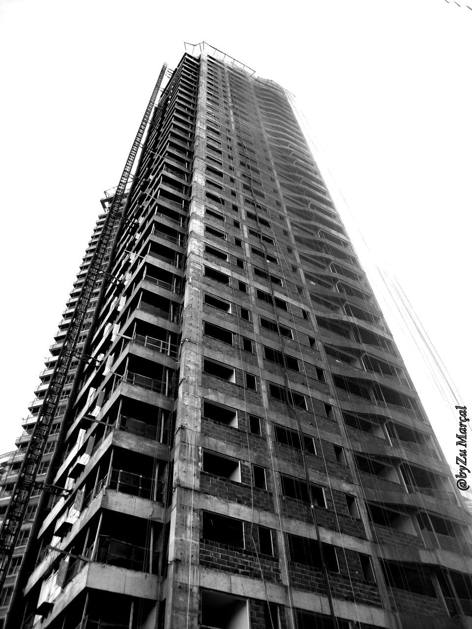 architecture, low angle view, built structure, building exterior, modern, office building, city, skyscraper, clear sky, tall - high, building, tower, sky, glass - material, day, tall, outdoors, no people, city life, development