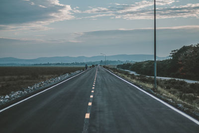 Empty road against sky