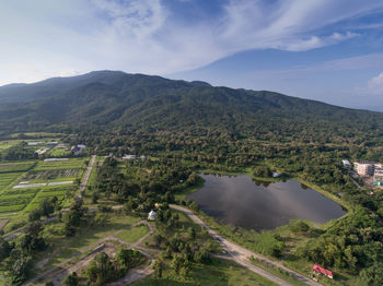 Scenic view of agricultural landscape against sky