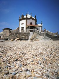 Low angle view of building against blue sky