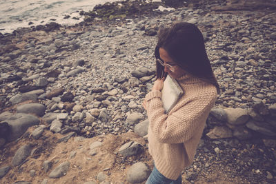 Woman standing at beach