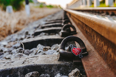 Close-up of heart shape on railroad track