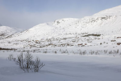 Scenic view of snowcapped mountains against sky