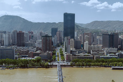 Modern buildings in city against sky