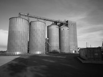 Low angle view of factory against sky