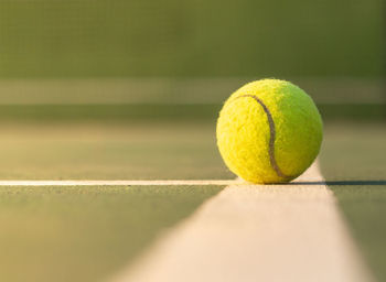 Close-up of tennis ball on court