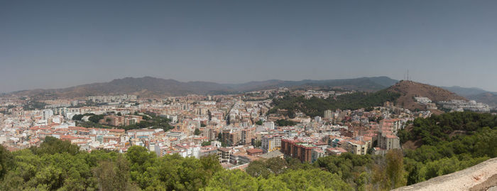 Aerial view of town against clear sky