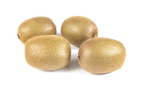 Close-up of fruits against white background