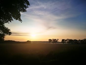 Scenic view of silhouette landscape against sky during sunset