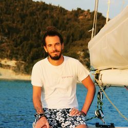 Portrait of young man in boat