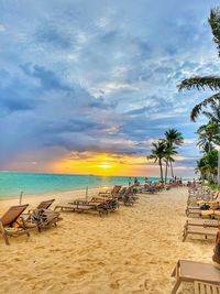 Scenic view of beach against sky during sunset