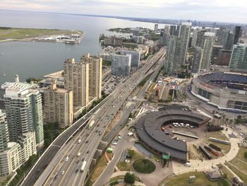 High angle view of traffic on road amidst buildings in city