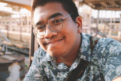 Close-up portrait of smiling young man