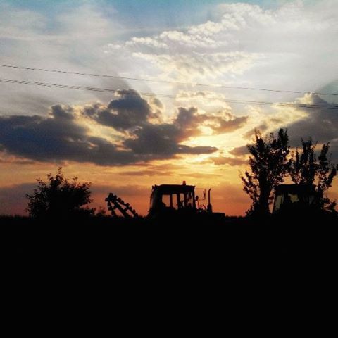 silhouette, sunset, sky, orange color, beauty in nature, tranquility, cloud - sky, scenics, tranquil scene, nature, tree, landscape, cloud, idyllic, dramatic sky, dark, cloudy, outline, outdoors, low angle view