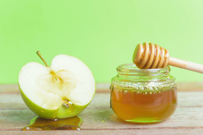 Close-up of juice in glass jar on table