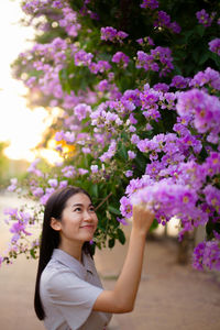 Portrait of woman with pink flowers