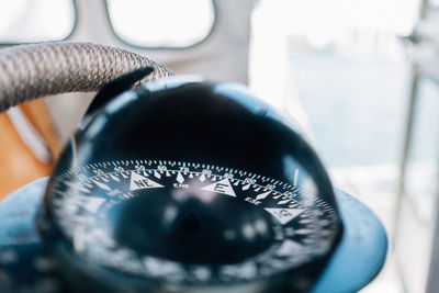 Close-up of compass in boat