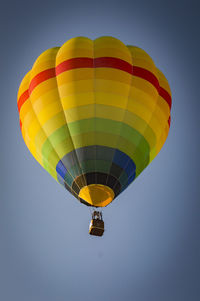 Low angle view of hot air balloon flying in sky