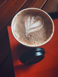 High angle view of cappuccino on table