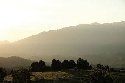 Scenic view of mountains against sky during sunset