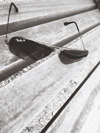 High angle view of sunglasses at beach