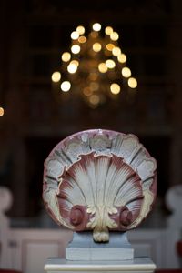 Close-up of illuminated medieval wood carved shell in monestary