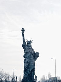 Low angle view of statue against sky