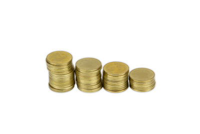 High angle view of coins on white background