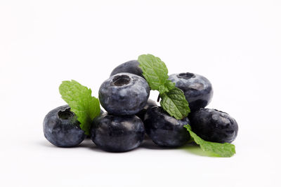 Close-up of blueberries against white background