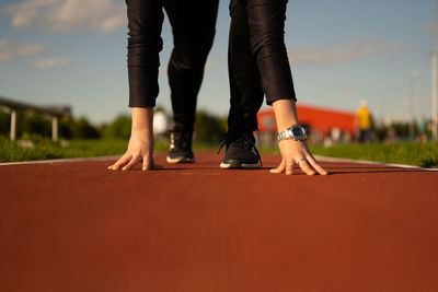 Low section of woman on running track