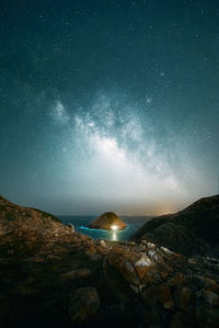 Scenic view of mountains against sky at night