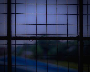 View of blue sky seen through window