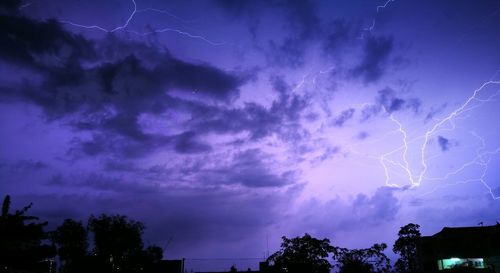 Low angle view of lightning in sky at night
