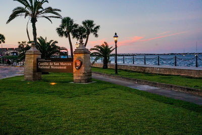 View of palm trees by sea