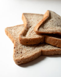 Close-up of bread against white background