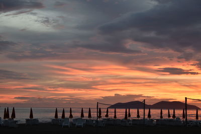 Scenic view of beach against sky during sunset