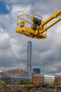 Low angle view of amusement park ride against sky