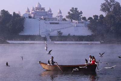 People on boats in water