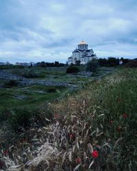 View of temple against cloudy sky