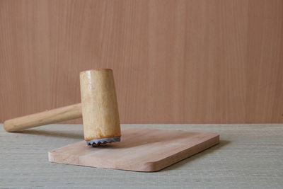 Close-up of bread on cutting board on table