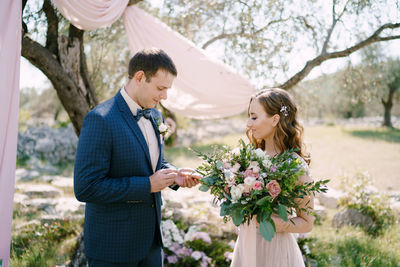 Portrait of bride holding bouquet