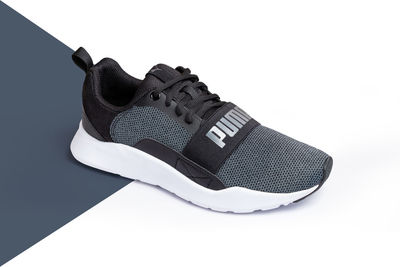 Close-up of black and white shoes