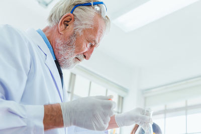 Midsection of man looking at camera