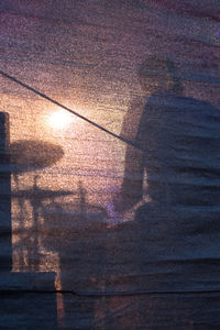 High angle view of street against sky at sunset