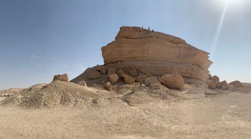 Rock formations in desert against sky