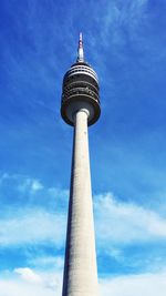 Low angle view of tower against cloudy sky