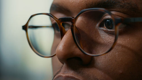 Close-up of man wearing eyeglasses