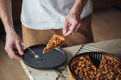 Midsection of man preparing food