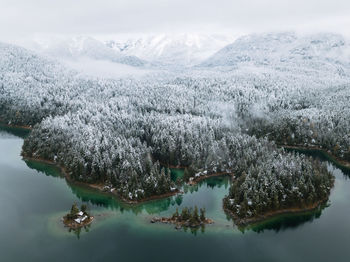 Aerial view of lake and mountains during winter